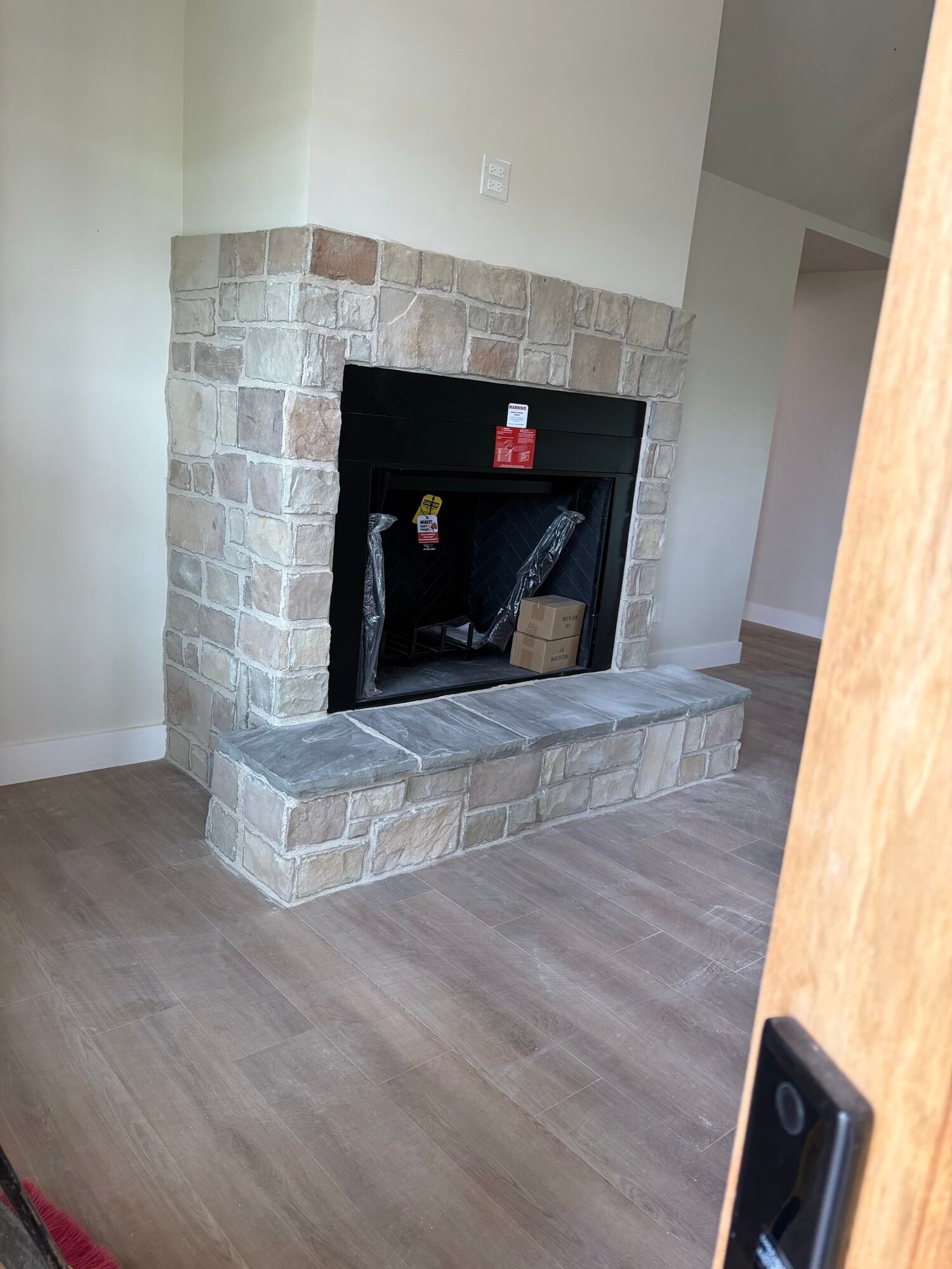 Interior stone fireplace with hearth