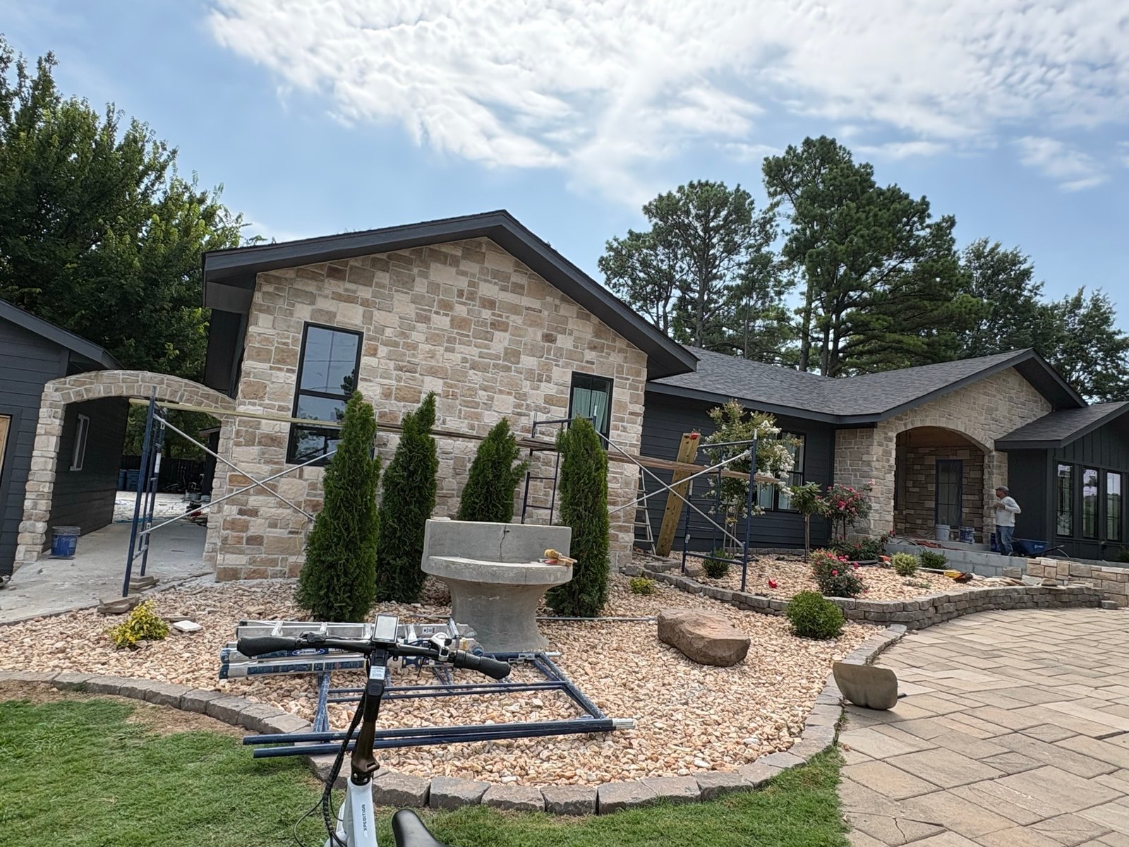Finished stone gable and breezeway with landscaping