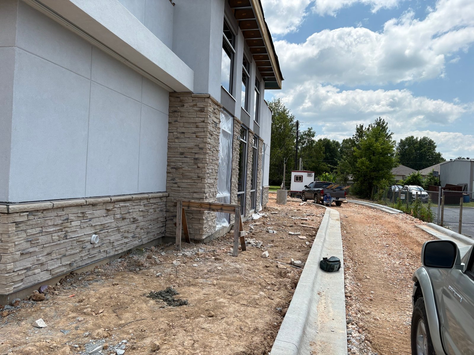 Stucco exterior with stone veneer base